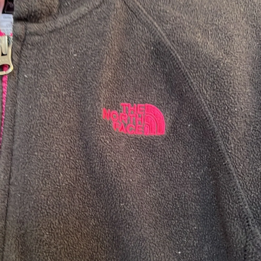 The North Face girls black fleece jacket in size medium 10-12